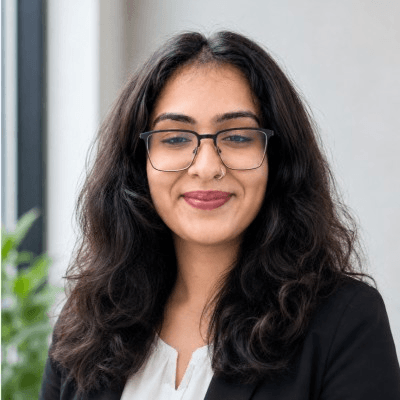 Suhani Bhatia, photographed in natural light against a plain wall